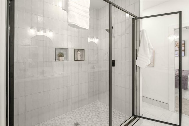 bathroom featuring a shower stall