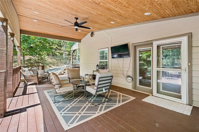 21574 Indian Creek Dr, Garfield, AR 72732 - wooden deck with an outdoor living space and a ceiling fan
