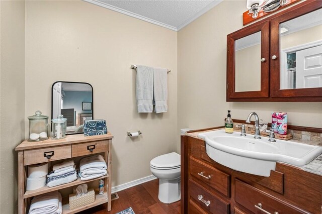 21574 Indian Creek Dr, Garfield, AR 72732 - bathroom with vanity, wood finished floors, a textured ceiling, crown molding, and toilet