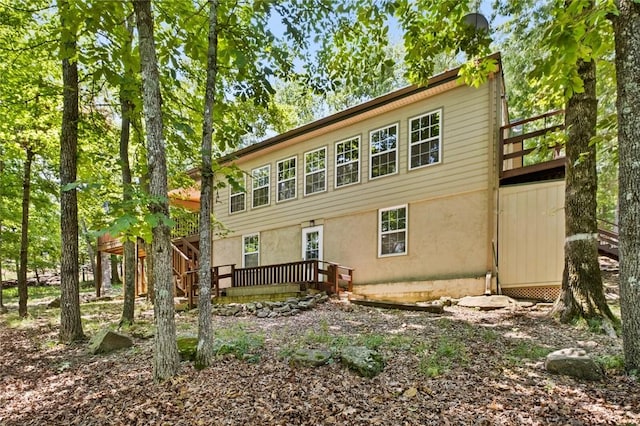 21574 Indian Creek Dr, Garfield, AR 72732 - back of property with a wooden deck and stucco siding