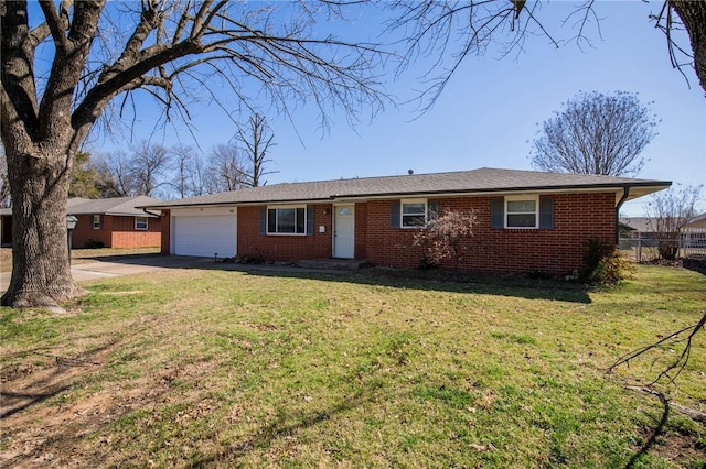 ranch-style home featuring driveway, fence, a front yard, an attached garage, and brick siding