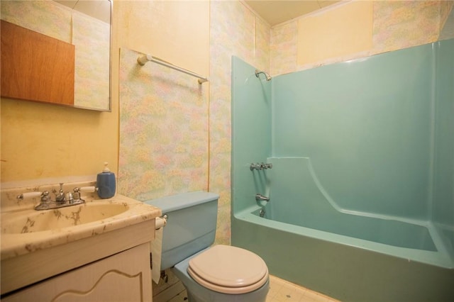 bathroom featuring shower / bathing tub combination, toilet, and vanity