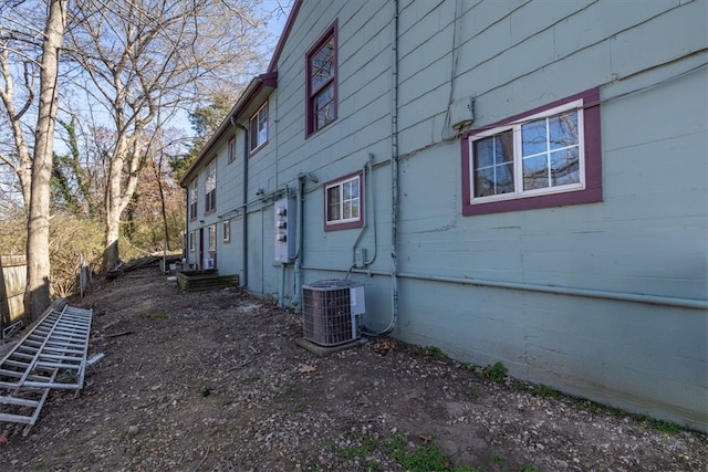 view of side of property with central AC unit