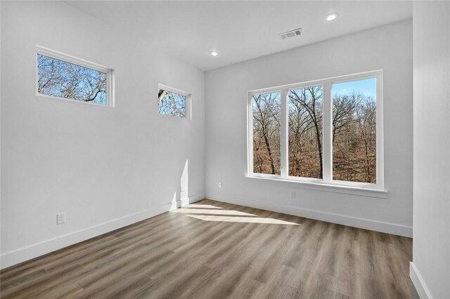 10 Reading Ln, Bella Vista, AR 72714 - empty room with recessed lighting, visible vents, baseboards, and wood finished floors