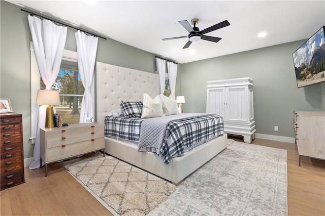 bedroom with recessed lighting, wood finished floors, baseboards, and ceiling fan
