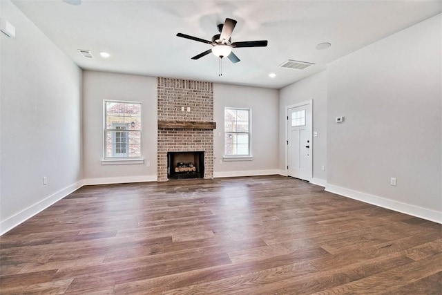 unfurnished living room featuring a ceiling fan, baseboards, visible vents, and plenty of natural light
