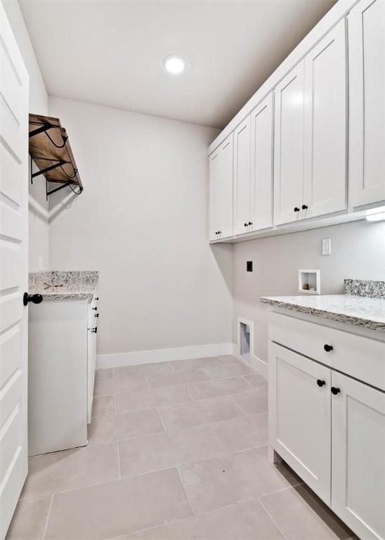 laundry area featuring cabinet space, recessed lighting, washer hookup, and baseboards