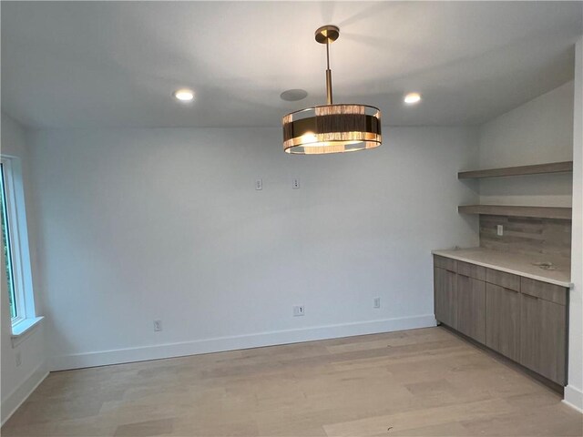123 S Paddock Loop, Fayetteville, AR 72701 - unfurnished dining area with baseboards, light wood-type flooring, and recessed lighting