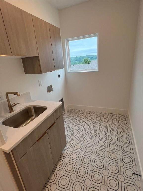 123 S Paddock Loop, Fayetteville, AR 72701 - washroom featuring cabinet space, baseboards, hookup for an electric dryer, and hookup for a washing machine