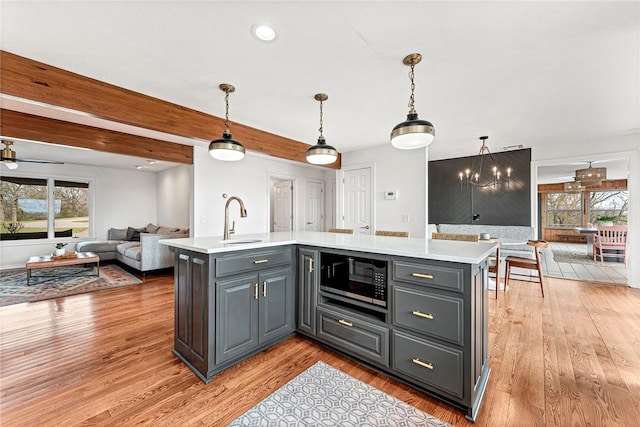 109 Woodcliff Cir, Springdale, AR 72764 - kitchen with built in microwave, a sink, light countertops, plenty of natural light, and recessed lighting