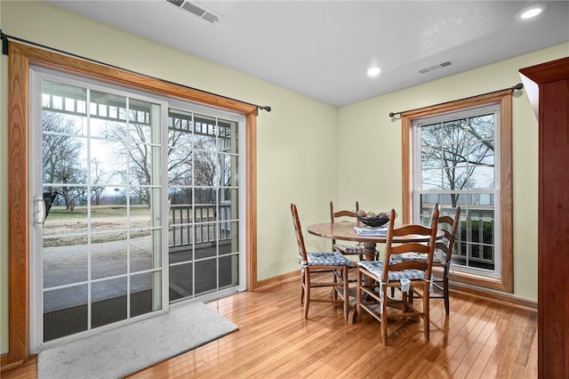 2428 Winn Mountain Loop, Mountainburg, AR 72946 - dining room with baseboards, visible vents, and light wood-style flooring