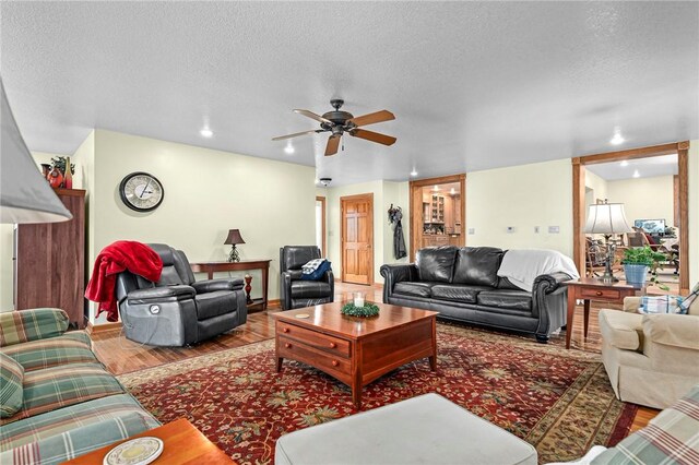 2428 Winn Mountain Loop, Mountainburg, AR 72946 - living area featuring a textured ceiling, baseboards, recessed lighting, wood finished floors, and ceiling fan
