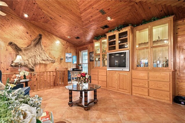 2428 Winn Mountain Loop, Mountainburg, AR 72946 - living area with lofted ceiling, wooden walls, visible vents, light tile patterned floors, and wood ceiling