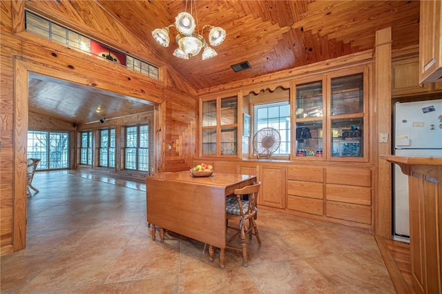 2428 Winn Mountain Loop, Mountainburg, AR 72946 - interior space featuring wooden walls, vaulted ceiling, wooden ceiling, and an inviting chandelier