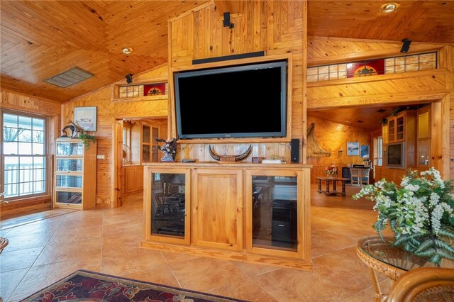 2428 Winn Mountain Loop, Mountainburg, AR 72946 - tiled living room with wooden ceiling, wood walls, vaulted ceiling, and wine cooler