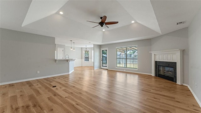 108 Birch St, Centerton, AR 72719 - unfurnished living room featuring recessed lighting, light wood-type flooring, a ceiling fan, a glass covered fireplace, and baseboards