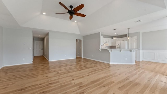 108 Birch St, Centerton, AR 72719 - unfurnished living room with a ceiling fan, light wood-style flooring, recessed lighting, a raised ceiling, and vaulted ceiling