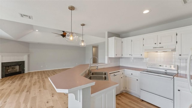 108 Birch St, Centerton, AR 72719 - kitchen with white appliances, a sink, under cabinet range hood, a peninsula, and light wood finished floors