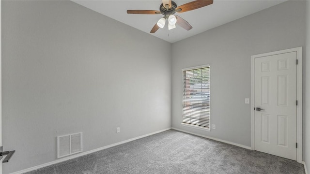 108 Birch St, Centerton, AR 72719 - carpeted spare room with vaulted ceiling, a ceiling fan, and baseboards
