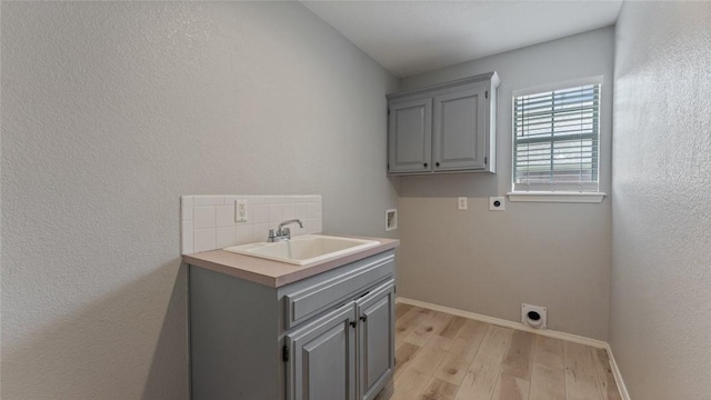 108 Birch St, Centerton, AR 72719 - laundry room featuring hookup for an electric dryer, light wood-style flooring, baseboards, washer hookup, and cabinet space