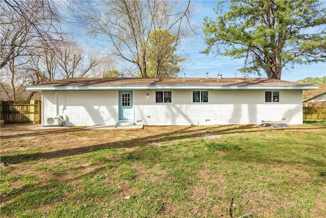 back of house featuring brick siding