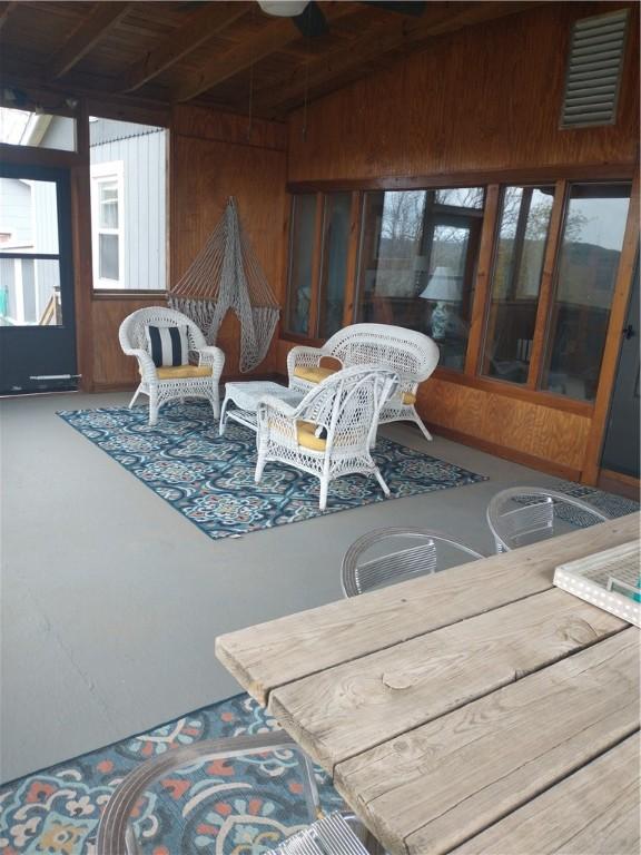 82 County Road 327, Berryville, AR 72616 - sunroom / solarium featuring wooden walls, plenty of natural light, and wood ceiling with exposed beams