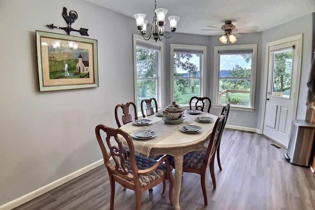 82 County Road 327, Berryville, AR 72616 - dining room with baseboards, a chandelier, wood finished floors, and ceiling fan
