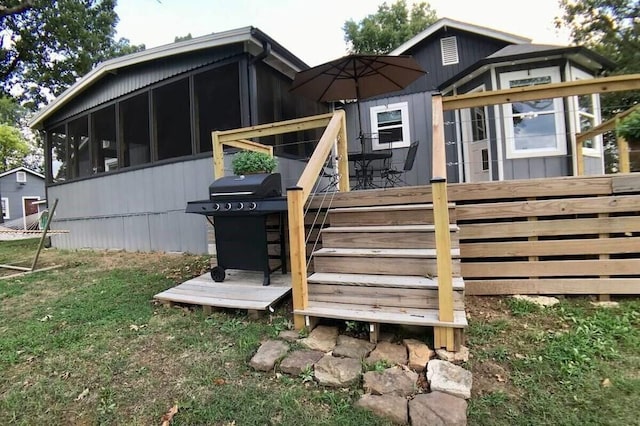 82 County Road 327, Berryville, AR 72616 - rear view of property featuring a sunroom and a deck