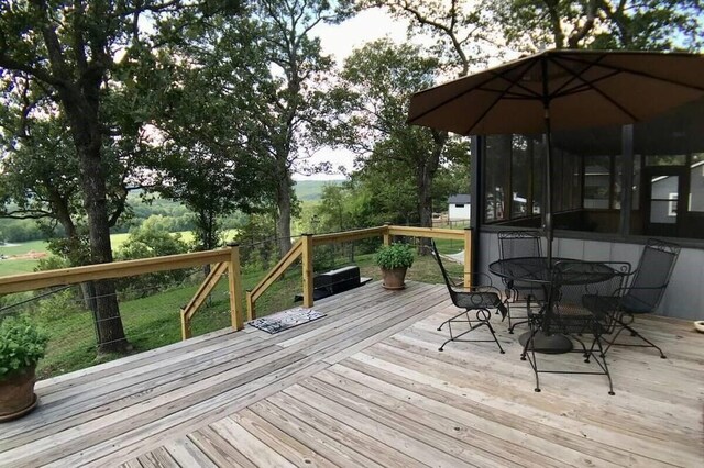 82 County Road 327, Berryville, AR 72616 - wooden terrace featuring outdoor dining space and a yard