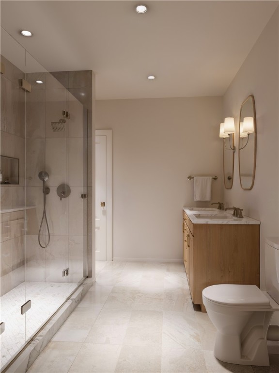 423 SE B St, Bentonville, AR 72712 - bathroom featuring vanity, toilet, baseboards, and a stall shower