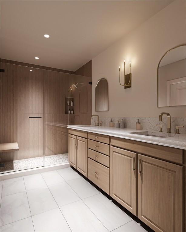 425 SE B St, Bentonville, AR 72712 - bathroom with double vanity, tile patterned floors, walk in shower, and a sink