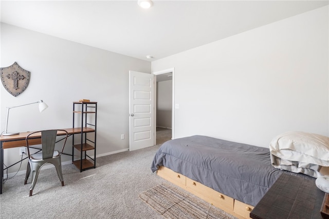 bedroom with baseboards and carpet floors