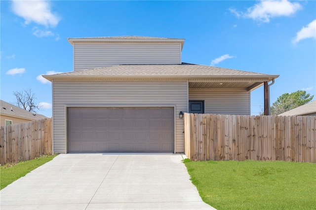 view of front of house featuring concrete driveway, a front lawn, a shingled roof, an attached garage, and fence