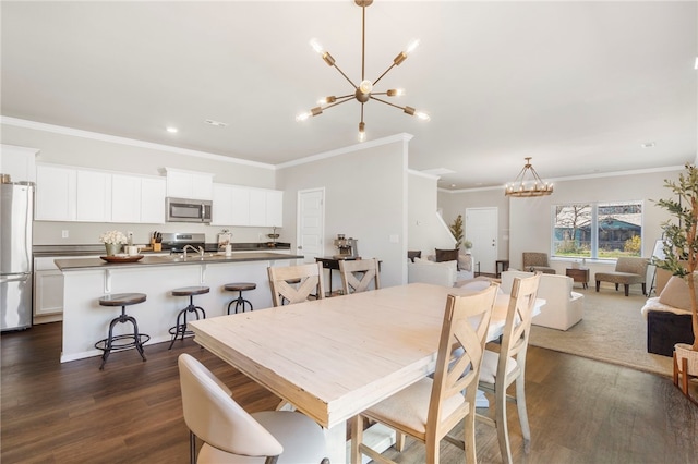dining room featuring dark wood-style floors, recessed lighting, a notable chandelier, and ornamental molding