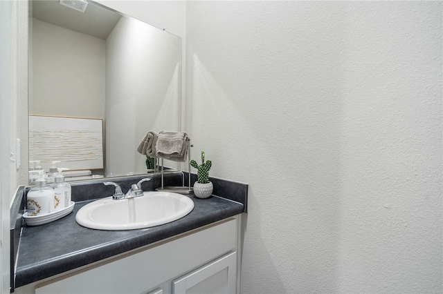 bathroom featuring vanity and visible vents