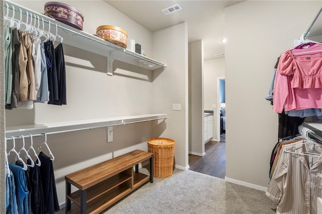 walk in closet with carpet flooring and visible vents