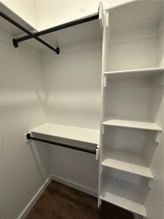 11 Romine Ln, Bella Vista, AR 72715 - walk in closet featuring dark wood-style floors