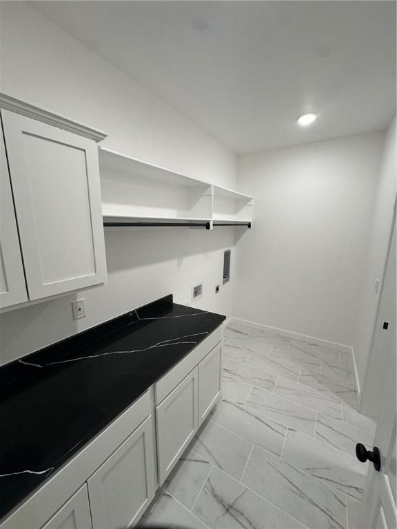 11 Romine Ln, Bella Vista, AR 72715 - laundry area featuring hookup for an electric dryer, light marble finish flooring, washer hookup, cabinet space, and recessed lighting