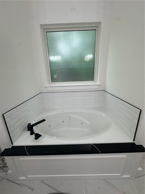 11 Romine Ln, Bella Vista, AR 72715 - bathroom with marble look tile flooring and a jetted tub