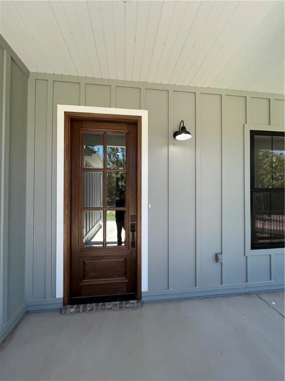 11 Romine Ln, Bella Vista, AR 72715 - doorway to property with board and batten siding