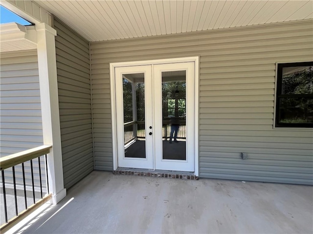 11 Romine Ln, Bella Vista, AR 72715 - property entrance featuring french doors and a patio area