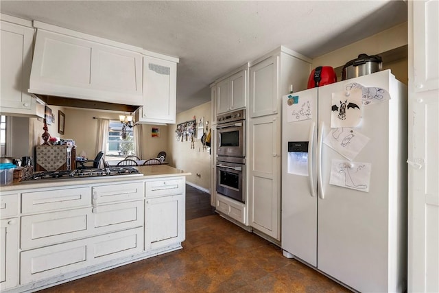 610 NE A St, Bentonville, AR 72712 - kitchen with white cabinetry, light countertops, and stainless steel appliances