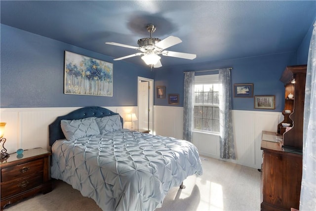 16101 Hickory Dr, Rogers, AR 72756 - carpeted bedroom with a wainscoted wall and ceiling fan