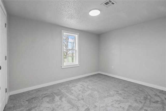 291 E Pilcher Rd, Kansas, OK 74347 - carpeted spare room featuring a textured ceiling and baseboards