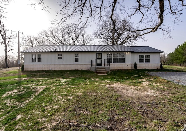 291 E Pilcher Rd, Kansas, OK 74347 - ranch-style home with brick siding, metal roof, and board and batten siding