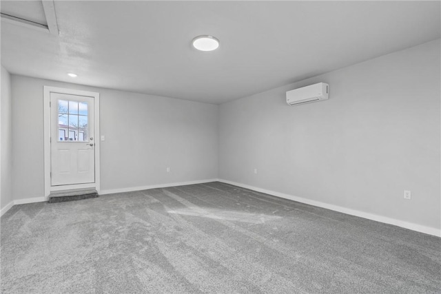 291 E Pilcher Rd, Kansas, OK 74347 - spare room with a wall mounted air conditioner, baseboards, and carpet flooring