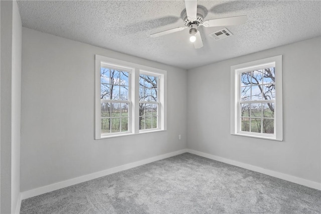 291 E Pilcher Rd, Kansas, OK 74347 - unfurnished room featuring carpet floors, a textured ceiling, baseboards, and a ceiling fan