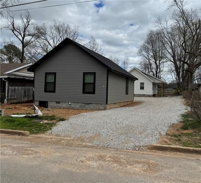 311 Douglas St, Berryville, AR 72616 - view of side of property with gravel driveway and crawl space