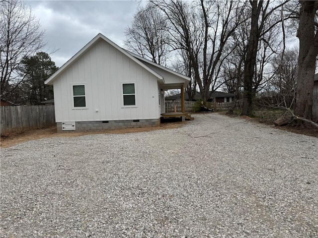313 Douglas St, Berryville, AR 72616 - view of side of home featuring crawl space and fence