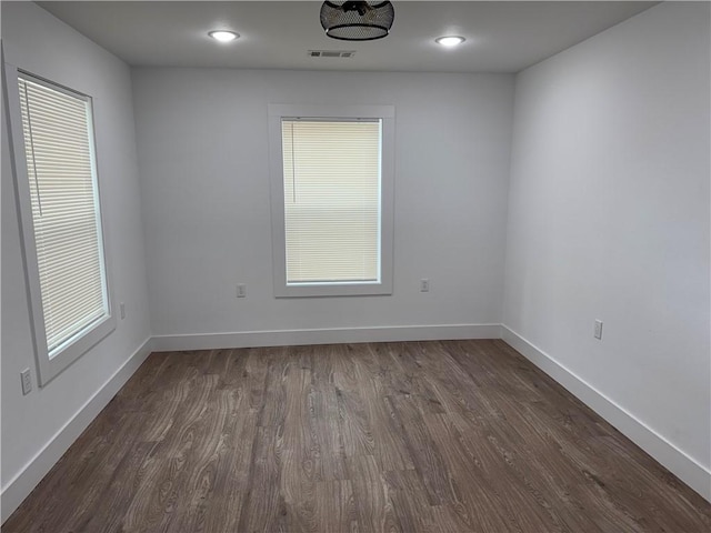 313 Douglas St, Berryville, AR 72616 - spare room featuring recessed lighting, baseboards, visible vents, and dark wood-style flooring